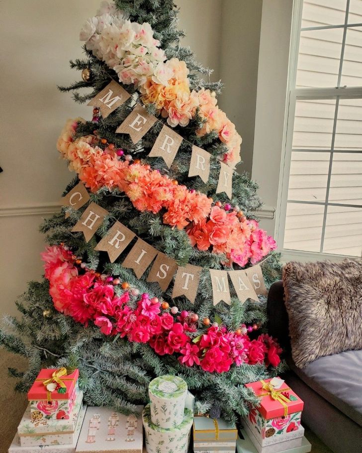 colorful silk faux flower Christmas tree with Merry Christmas banner