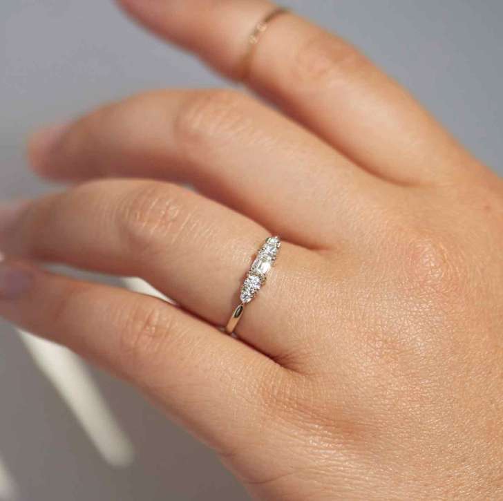 recycled gold small symmetrical diamond simple engagement rings