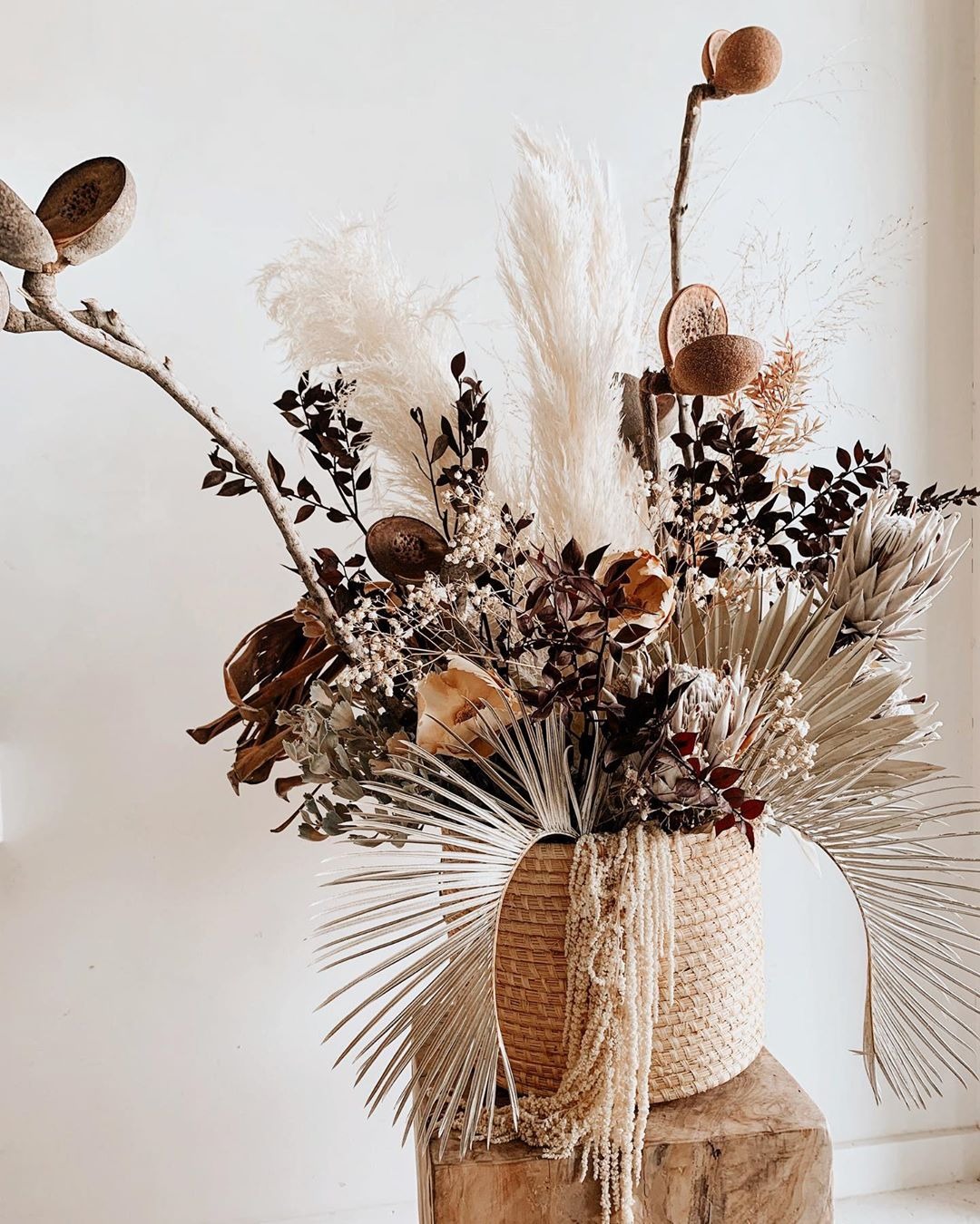 boho style dried flower arrangement sitting sitting in a vase
