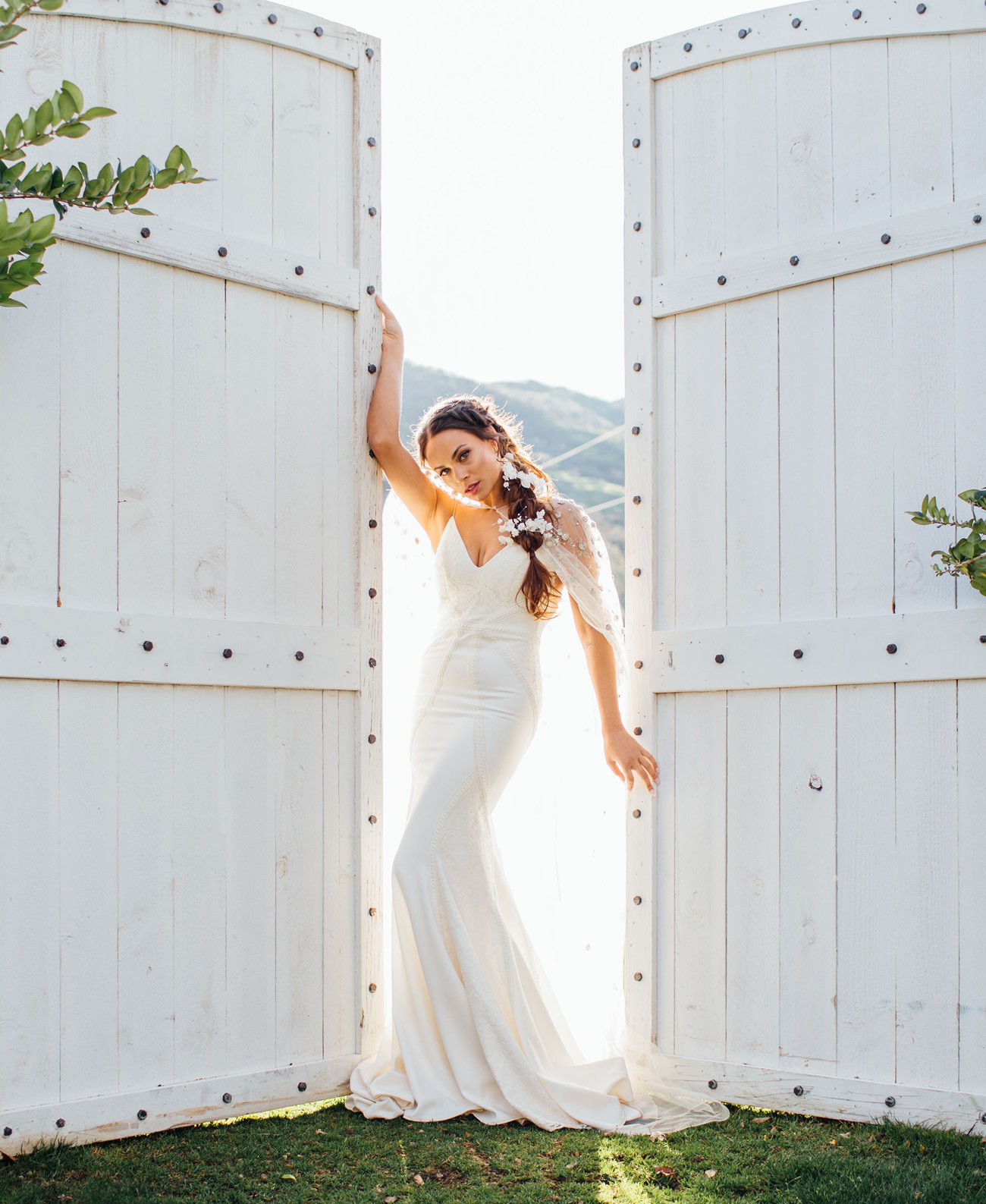 Lovers Society x Green Wedding Shoes Wyatt Wedding Dress paired with a cape